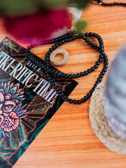 A close-up of a 'Tiki-Rific Time' themed card, a fun and playful detail that adds to the guest experience.