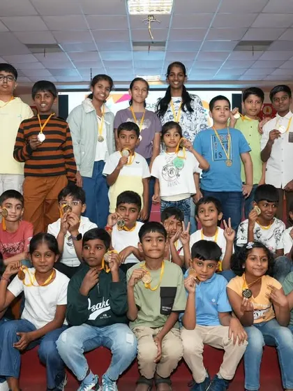 A proud group of participants and medal winners posing on stage after the competition. Every participant is a champion.