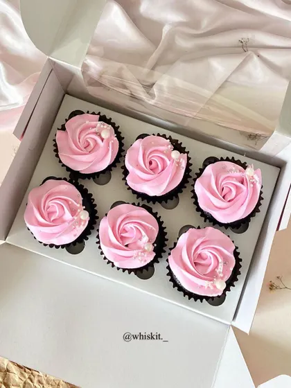 A full box of my pink strawberry cupcakes, ready to be delivered. The consistent and clean piping makes for a beautiful presentation.