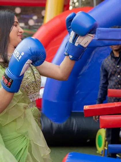 Even in a beautiful lehenga, this guest couldn't resist a round of inflatable boxing. I plan events where everyone feels free to let loose and have fun.
