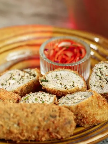 A close-up of the crispy, breaded exterior of my Chicken Swiss Rolls. Each roll is fried to a perfect golden brown, ensuring a satisfying crunch in every bite.