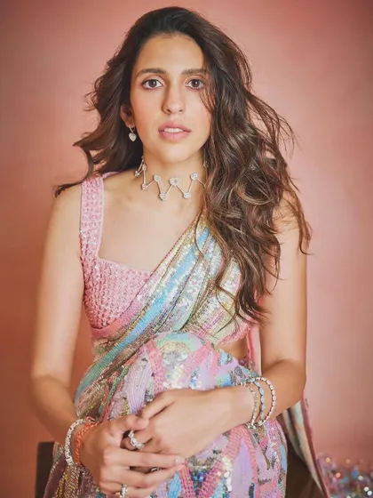 Hues of happiness. This multi-colored sequin saree by Manish Malhotra is pure joy. It's a fun, vibrant, and glamorous take on the classic saree.