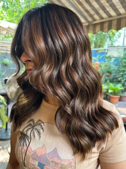 A side profile showing off the beautiful caramel highlights and face-framing layers. (No filter)