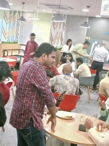A candid shot of employees networking and enjoying their meal during a catered event at Ceragon Networks. Good food brings people together.