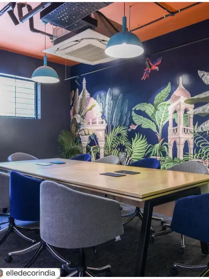 We transformed this meeting room with a vibrant, jungle-themed wallpaper and mismatched blue chairs. It’s an immersive space designed to spark creative thinking and break the monotony of typical corporate boardrooms.