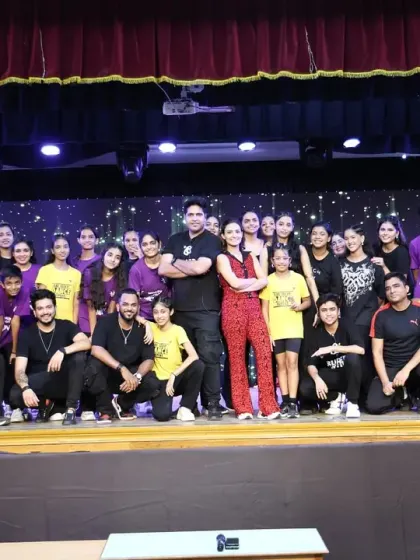 The entire team of instructors and choreographers with our students. We are a close-knit family dedicated to the art of dance.
