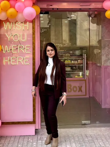 Welcome to Pink Box. We started this journey to create a place that feels special but also warm and familiar. I hope when you see our pink door and the "Wish You Were Here" sign, you feel invited to come in and make a sweet memory.