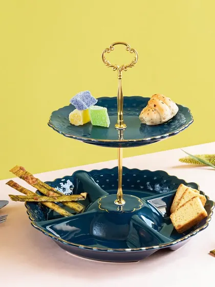 This two-tiered serving stand in a deep teal is both stylish and practical. The lower dish is partitioned for different snacks, while the upper tier is perfect for small bites or sweets.