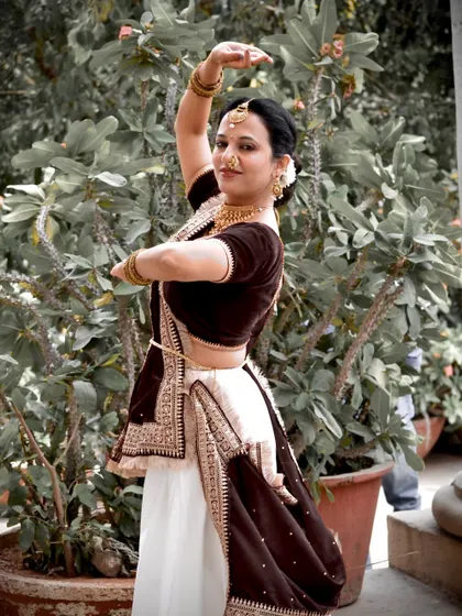 This semi-classical dance pose highlights the importance of expression and posture, elements I focus on even in simpler routines to elevate the performance.