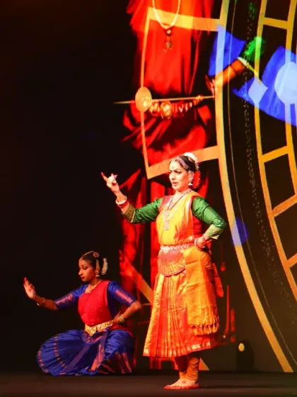 A close-up of a dancer during the AWS AI Conclave performance. The background visuals, generated by AI, respond to the dance, making each performance a unique collaboration between the artist and the algorithm.
