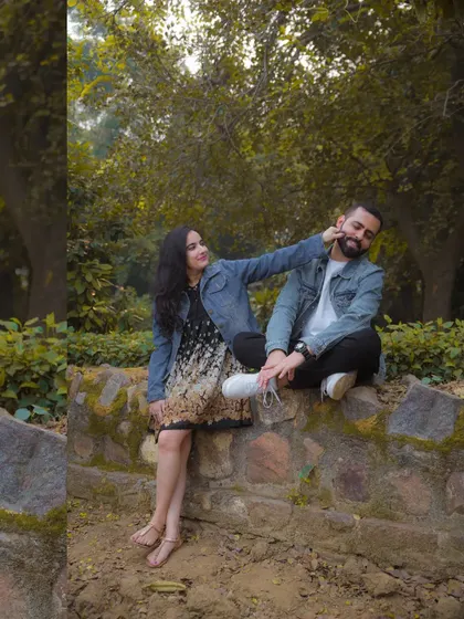 A playful and candid moment from their outdoor pre-wedding session. It’s the genuine laughter and interactions that make these photos so special.