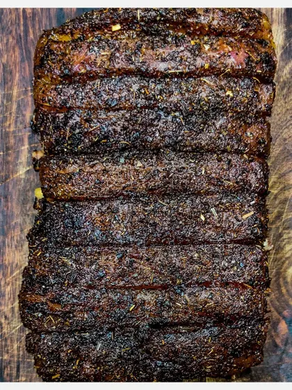 This is my signature Karnivore Ribs rack, seasoned with a special spice rub. The dark, flavourful crust is the result of slow grilling, which makes the meat incredibly tender.