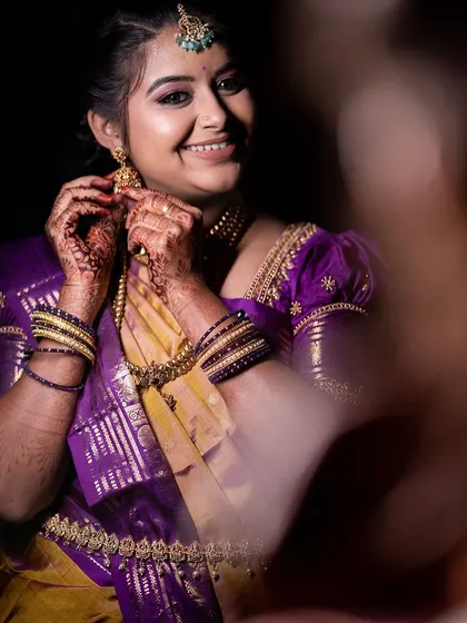 A candid of Varshini adjusting her earring, looking absolutely radiant.
