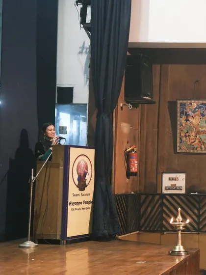 Addressing the audience at the Ayyappa Swamy Temple performance. It is always a pleasure to introduce my students and share the context of the pieces they present.