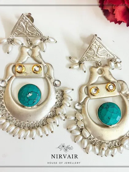 Statement replica silver earrings with turquoise stones, a popular find in our jewellery section.