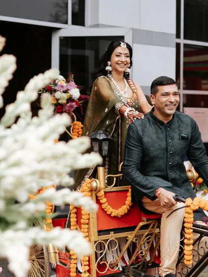 The happy couple making their entrance on the decorated rickshaw. I love planning these unique entry moments that add a touch of fun and personality to the event.