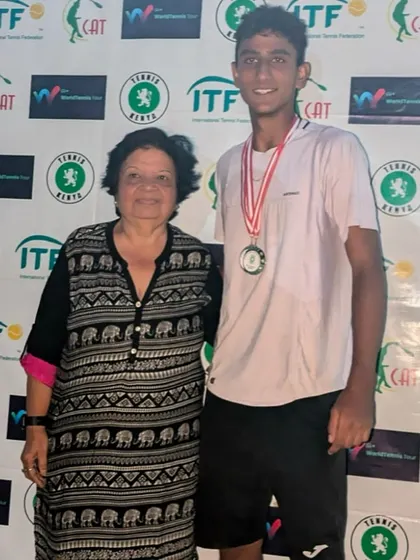Posing with the trophy after a successful tournament in Kenya.