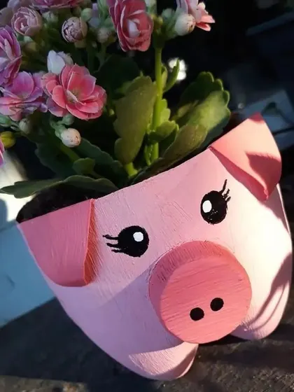 This adorable pig planter is crafted from a recycled bottle and holds a lovely bunch of pink flowers. It’s a sweet and simple way to add a bit of farm charm to your balcony.