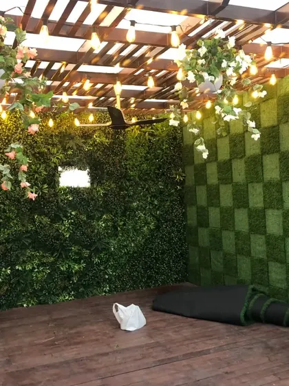 The finished pergola space, ready for the client to enjoy. The combination of different textures and lighting creates a very high-end and inviting atmosphere.