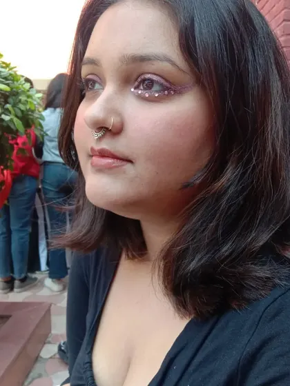 A dramatic under-eye design using pink glitter and gems. This is perfect for a bold party or concert look.