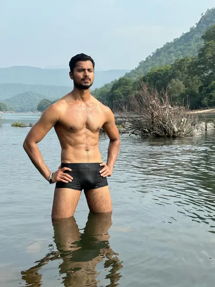 A classic fitness pose in a natural setting, highlighting my core and upper body strength.