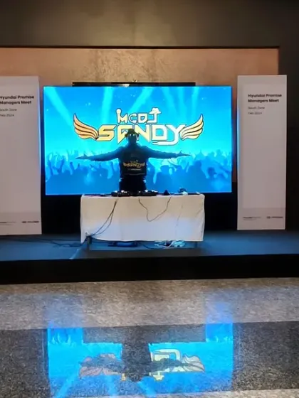My setup for a Hyundai sales management offsite. The large LED screen prominently features my custom VJ graphics, creating a dynamic backdrop for the event.