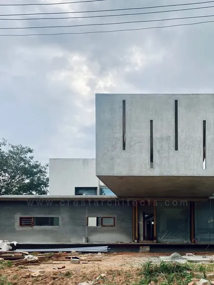 Another view of the Long House's raw concrete structure, highlighting its bold geometric composition.