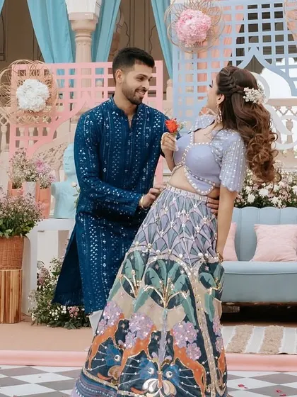 A sweet, romantic pose during a daytime couple's dance. The colorful decor and natural light make for a beautiful setting, and we choreograph moments like these to feel natural and full of love.