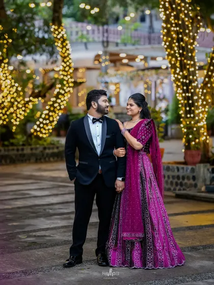 A classic, elegant portrait of the couple at their outdoor reception, looking at each other with love.