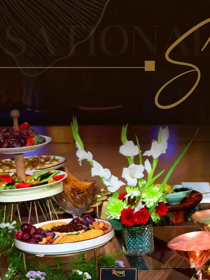 A multi-tiered display featuring a vibrant assortment of fruits, vegetables, and dips. Our grazing tables are a feast for the eyes and perfect for encouraging guest interaction.
