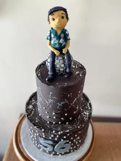 A closer look at the disco cake, showing the custom topper and silver details.