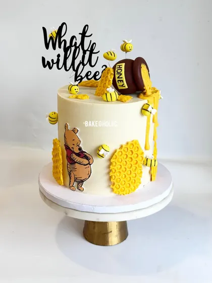 "What will it bee?" Another adorable baby shower cake that avoids the usual pink and blue. This 2.5kg eggless chocolate truffle cake features a Winnie the Pooh and honey bee theme.