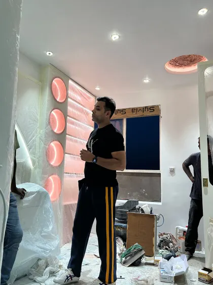 Discussing the final placement of elements in the kid's room with my team.