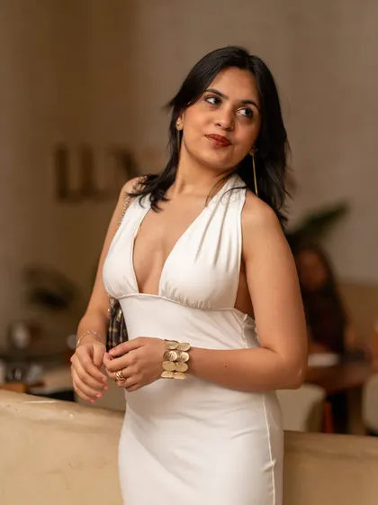 The stylish and vibrant crowd at Lumara. A guest looking elegant while enjoying the rooftop atmosphere and fresh cocktails.