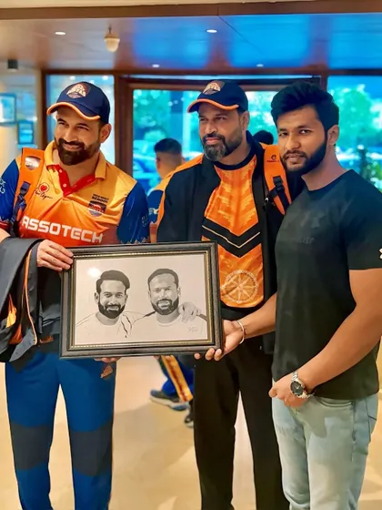A photo with the Pathan brothers, Irfan and Yusuf, after gifting them a joint portrait. Two legends in one frame.