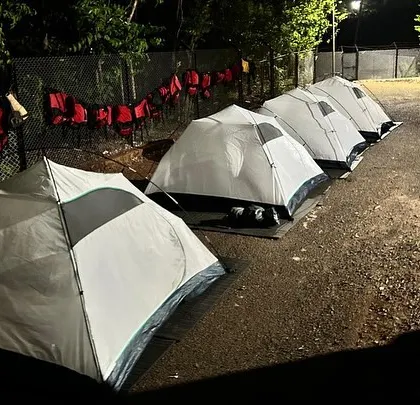 This is what camp life looks like after a day of adventure at our Dandeli course. Participants rest in their tents, sharing stories under the stars, ready for the next day's challenges.