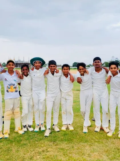 A happy team photo after a good day on the cricket field.