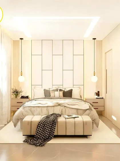 A bright, white-themed bedroom with a panelled headboard and globe pendant lights, creating a serene and peaceful atmosphere.