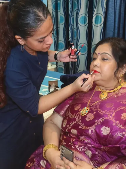 A behind the scenes shot of me applying lipstick. It's always a pleasure to work with her and create these beautiful, classic looks.