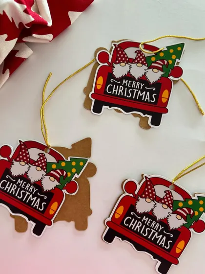 Adorable handmade Christmas tags featuring gnomes in a truck. These add a whimsical and crafty touch to your gift wrapping.