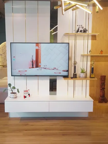 A look at a newly installed TV unit in our HSR Layout Experience Centre. This design combines white panels with light wood fluting and open shelving, creating a modern and airy feel.