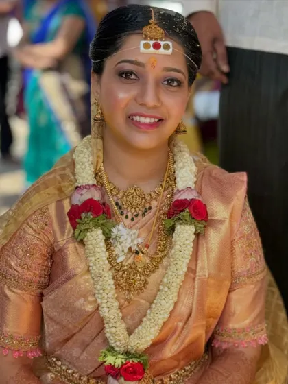 A close up of a happy bride during her muhurtham. The golden saree is draped to sit perfectly, even with the heavy garlands. My goal is to ensure the drape is secure through all the rituals.
