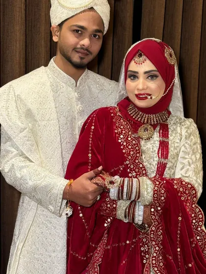 A loving moment between the bride and groom. Her makeup is designed to last through all the emotional moments of the day.