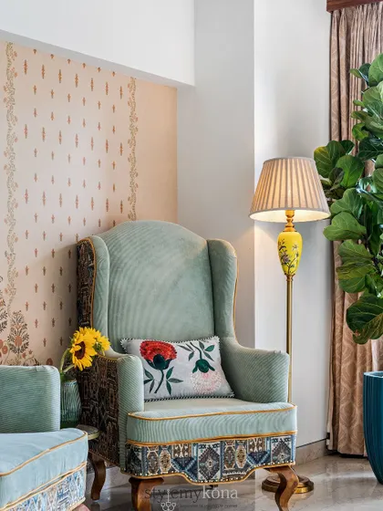 An accent chair can turn a bedroom into more than just a place to sleep. We added this customized armchair to create a cozy reading corner in this colonial-style bedroom, adding both function and personality.