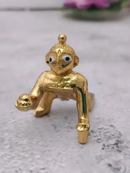 A clearer, well-lit image of the Panchaloham baby Krishna idol, showcasing its sweet expression.