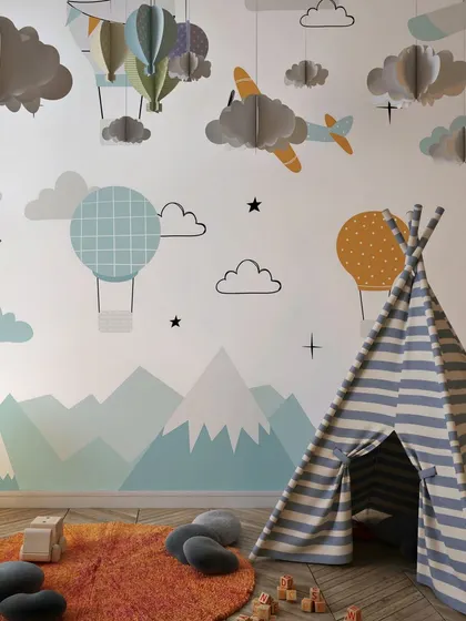 This children's room is a sky-high adventure with our hot air balloon and airplane wallpaper. The design sparks imagination and creates a fun and playful atmosphere for kids.