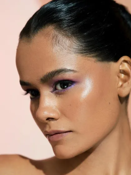 The highlight on the cheekbone is perfectly placed to enhance the model's bone structure.