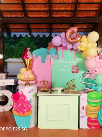A sweet treat for Roshvika's 5th birthday with this candy and ice cream theme. We used pastel colors, giant cupcake and macaron props, and a light-up number "5" to create a delicious-looking party.