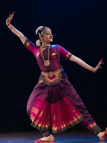 A graceful, flowing pose from a traditional recital. This movement captures the elegance and poise of the Nayika as she moves through the narrative.