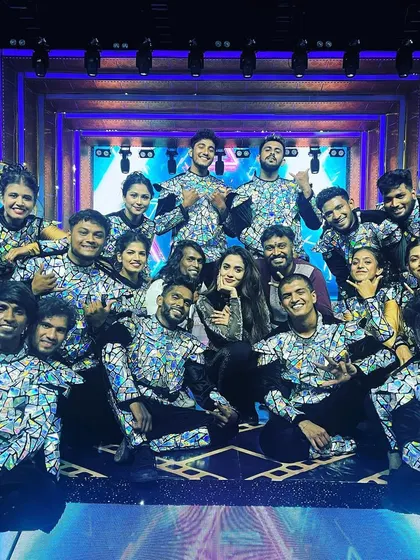A group photo with Teju Ashwini and my dance team after a successful performance at the Ananda Vikatan Cinema Awards.